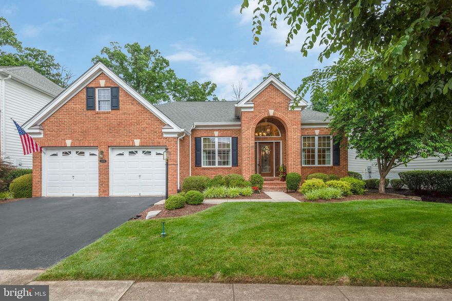 Active Adult 55+ living at its best… Toll Bros "Tradition" model situated on the #2 fairway/green in the sought-after REGENCY AT DOMINION VALLEY community! This home offers 2 bedrooms & 2 full baths on the main level, a huge unfinished basement, and GORGEOUS GOLF COURSE VIEWS! The foyer, with natural light from the decorative front door, opens directly to the living and dining rooms. The main level features beautiful hardwood floors, including in both bedrooms, a gourmet kitchen and breakfast area open to the family room w/ gas fireplace, and a SUNROOM that walks out to the SCREENED PORCH & COMPOSITE DECK. The UPDATED KITCHEN includes beautiful granite countertops, upgraded cabinetry with  "elegance" package trim, an updated ceramic backsplash, stainless appliances including double wall ovens, and a pantry. The breakfast area has French door access to the sunroom, which is perfect for relaxing with a good book. The primary bedroom features a tray ceiling, large walk-in closet, and sitting area with views of the golf course. The REMODELED PRIMARY BATH includes plank tile flooring, a zero-entry shower, an elegant double-sink vanity w/ extensive cabinetry, and a linen closet. The second main-level bedroom has a generous closet and is adjacent to the second main-level full bath.  The laundry room includes cabinets and walks out to the EXTENDED GARAGE, a sought-after feature! The garage includes a PANEL WALL ORGANIZER SYSTEM on the rear and far side wall, great for keeping things off the floor! The unfinished basement has FOUR WINDOWS and walks up (just 5 steps) to the paver patio.  The ROOF was REPLACED in 2017.  Regency at Dominion Valley residents enjoy access to a range of amenities, including an 18-hole golf course, indoor and outdoor swimming pools, fitness center, aerobics studio, lighted tennis & pickleball courts, walking & biking trails, community parks, outdoor amphitheater, and more! The Regency provides a vibrant and active lifestyle, with opportunities for socializing and recreation right at your fingertips. Conveniently located within walking distance to Dominion Valley Market Square featuring restaurants, shops, and Giant grocery & pharmacy; <5 miles from UVA Health System Haymarket Medical Center, the well-equipped Haymarket Gainesville Library, James Long Regional Park, and major commuter routes. The Regency is a great place to call home!