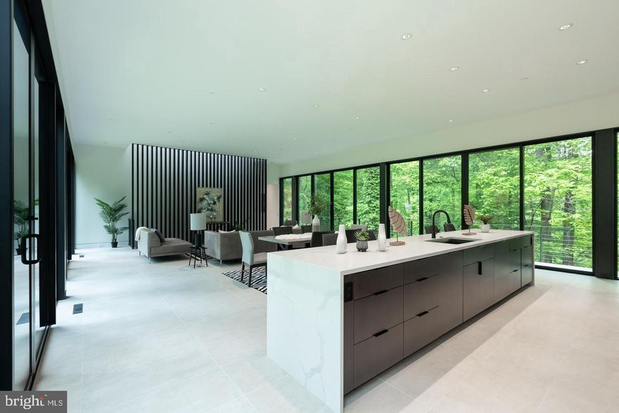 6/28 OPEN HOUSE CANCELLED 
Price to Sell - AS IS
“A TRANSCENDENT CONTEMPORARY ARCHITECTURAL MASTERPIECE IN POTOMAC’S WOODLANDS” Long-awaited and exceedingly rare, this 4,756 square foot Ziger|Snead contemporary residence at 11801 Stoney Creek Road is an internationally-inspired livable work of art seamlessly integrated into its naturalistic setting. 
The first level is concrete, while the upstairs is built with stainless steel. The exterior siding is made of a special wood called Shugi-Ban, which is directly imported from Japan. Shugiban is known for its durability, weather resistance, and aesthetic appeal. 
More importably this house is perched on 5 privately forested acres off River Road, the design by Douglas Bothner seems to float amongst the trees, with direct access to the Sandy Branch Creek. This house has won the 2024 Design Award from Baltimore AIA. “THE STRIKING FACADE” The home’s arresting yet organic facade features shou sugi ban, a traditional Japanese charred cypress wood siding technique producing a rich ebony tone and texture. “THE SERENE, MINIMALIST INTERIOR” Inside, the open, symmetrical floor plan celebrates minimalism, serenity, and exquisite luxury finishes. Smooth Italian tile floors flow throughout, complemented by polished concrete surfaces and countertops of pristine quartz. Two lengthy walls of floor-to-ceiling glass in the central living area create a pavilion-like feel, framing panoramic woodland views while connecting to the well-appointed bedroom suites at either end. “THE THOUGHTFUL LAYOUT” Adhering to feng shui principles, the 4-bedroom, 3.5-bath layout positions the sumptuous primary suite in the auspicious northeast corner and the generous in-law suite in the southeast. Two architecturally sculptural staircases with floating treads and glass railings access the lower-level recreation spaces, including two additional en-suite bedrooms, a large recreation room with projector and media capabilities, fully outfitted laundry room, and mudroom with built-in storage. “LUXURIOUS AMENITIES” No luxury detail was spared, from the sleek kitchen with top-tier appliances integrated into the minimalist cabinetry to the lavish bathrooms featuring oversized glass-enclosed showers and massive walk-in closets with custom systems. Each bedroom enjoys direct views of the lush forests and creek through walls of windows. “OUTDOOR LIVING & RECREATION” From the main living areas, doors open out to a spacious deck perfect for entertaining and taking in the tranquil ambiance. The home enjoys direct access to a private creekside setting along the Sandy Branch, allowing you to fully immerse yourself in natural surroundings. “SUSTAINABLE, GREEN DESIGN” The architectural concrete, steel, and wood forms meld seamlessly into the landscape through brilliant green design elements like micro bioretention planters filtering rainwater at the home’s corners, while dramatically suspended rain chains create a sculptural water feature. The pervious driveway allows runoff to absorb on-site, and the residence connects to municipal sewage, minimizing environmental impact. Energy-efficient insulation contributes to the sustainable LEED-inspired design. “A PRIME POTOMAC LOCATION” Conveniently located just minutes from elite educational institutions, this internationally-inspired contemporary sanctuary has been nominated for multiple prestigious architectural awards. A transcendent work of art uniting innovative design with nature, opportunities like this are exceptionally rare in Potomac’s lush woodlands.