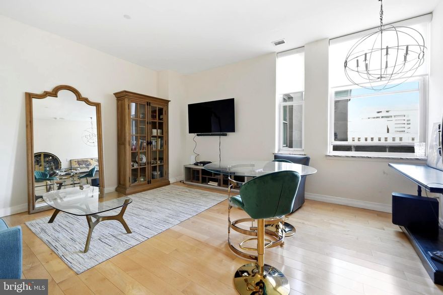 Step into this gorgeous one-bedroom residence, just shy of 1,000 square feet, perched on a high floor with stunning views of the Benjamin Franklin Parkway in a premier amenity building. This thoughtfully upgraded unit features beautiful maple hardwood floors and an open, chef-style kitchen complete with custom countertops and stainless steel appliances.
Enjoy modern convenience with motorized window shades and an LG smart steam washer/dryer that connects directly to your phone. The spacious primary bathroom offers both a stand-up shower and a separate tub/shower combination, along with a double vanity sink for added comfort.
Bring life to your Juliet balcony with plants and take in the abundant natural light that fills the space throughout the day.
Residents of The Phoenix enjoy five-star amenities, including 24/7 concierge service, a rooftop terrace, media room, and fully equipped fitness center. With direct access to Suburban Station, commuting is effortless. Ideally located near world-class museums, a short walk to Rittenhouse Square, and surrounded by top dining and shopping destinations.

Schedule your private tour today