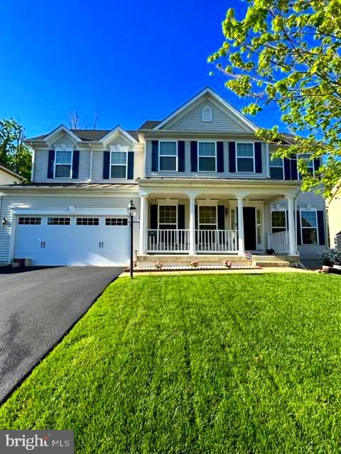 Welcome to your dream home, this colonial style home has a charming front porch, 4 bedrooms and an office, 3 full baths and 1 half bath making it the perfect choice for families of all sizes. Upon entering, you are greeted by the stunning hardwood floors. The gourmet kitchen is a chef's delight, boasting an array of modern amenities. It features sleek granite countertops, ample cabinet space, a pantry, black appliances, and a center island Upstairs, you'll find the master suite, which serves as a private retreat. It boasts a generous bedroom area, a walk-in closet, an en-suite bathroom with dual vanities, a soaking tub, and a separate shower. Three additional well-appointed bedrooms on this level offer ample space for family members or guests, each with its own closet and easy access to a full bathroom. This home also features a finished basement, providing additional living space. The basement also includes a full bathroom and a workshop. Outside, you'll discover a deck surrounded by woods.