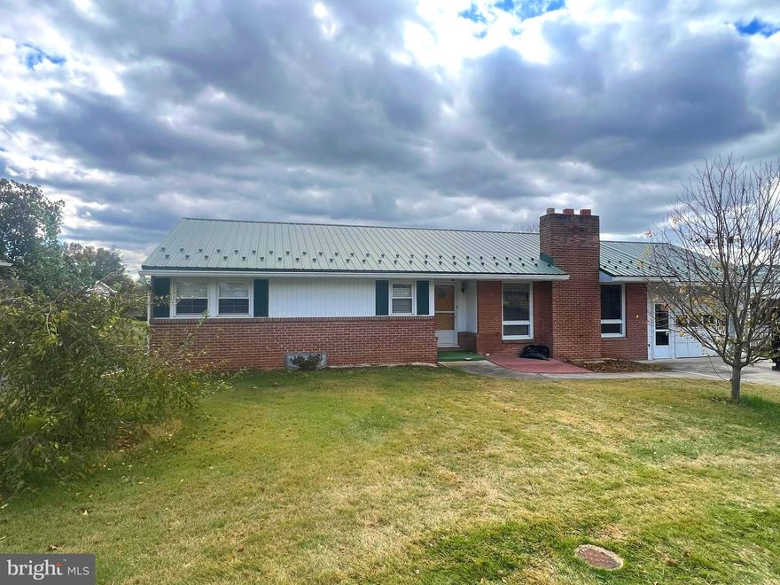 Great home in great convenient location. Hard wood floors, large spacious Living room with Fireplace. Replacement windows, Maintenance Free Metal Roof , Large finished area in the lower level with daylight and walk out entance, Over 600 sq. ft. real knotty pine finished area. Central Air. The septic has been pumped and inspected. The fireplace looks like it has never been used. The rear of the home features a Nice large patio, flat yard and garden shed. Don't hesitate, priced to sell, It won't last long.