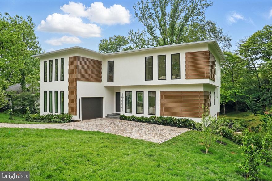 5.75% 30-YEAR FIXED AVAILABLE FOR QUALIFIED BUYERS ON THIS HOME! CALL THE LISTING AGENT TODAY FOR DETAILS! ***2023 Bennington 20 SVL Boat Conveys!*** Welcome to a contemporary masterpiece in the sought-after Lake Barcroft where modern design meets breathtaking lake views! This newly constructed, sleek white stucco residence showcases striking architectural lines, with tall narrow windows framing the front & expansive floor-to-ceiling glass walls along the rear, offering panoramic views of the water. Step inside & be instantly captivated by the open living area, where a full wall of floor-to-ceiling windows blurs the lines between indoor & outdoor living. At the heart of the home lies a true chef’s dream, an oversized gourmet kitchen designed for both function & flair, featuring custom floor-to-ceiling oak cabinetry, a dramatic waterfall island, marble countertops & backsplash, high-end SS appliances, range hood, pot filler, wall oven, built-in espresso machine & more. The sun-drenched breakfast area, surrounded by walls of glass & a sliding door, leads to a Trex deck overlooking tranquil lake views. Tucked beyond the kitchen, you'll find a walk-in pantry with custom cabinetry & a beautifully appointed mudroom with built-ins & a full-size washer & dryer. Just off the living room, the main-level owner's suite features direct deck access, breathtaking lake views, a walk-in closet, and a luxurious en-suite bath. This versatile space can also be used as a home office. A stylish powder room completes this level, which boasts soaring ceilings, recessed lighting & sleek marble floors. Ascend the floating hardwood staircase with modern iron railing beneath a show-stopping crystal chandelier to the upper level where the primary suite is nothing short of spectacular. Floor-to-ceiling windows invite endless lake views, while a marble-accented gas fireplace & private deck create the ultimate retreat. The suite includes dual walk-in closets with custom built-ins & a spa-inspired bath featuring a double vanity, a soaking tub & a frameless glass shower with dual shower heads & hand sprays. 3 additional bedrooms are thoughtfully designed on this level, 2 of which share a Jack-&-Jill bathroom featuring a double vanity, brass fixtures, designer sconces & a shower/tub combination. Each bedroom offers plenty of closet space for comfortable & organized living. The 3rd bedroom faces the front of the home & features a spacious closet. A beautifully appointed full bath is in the hallway, complete with a vanity & large glass shower doors enclosing a luxurious spa shower. This floor also includes a 2nd full-size laundry room outfitted with custom cabinetry, marble counters & a sink, adding convenience & functionality to this elegant level, which is finished with hardwood flooring, recessed lighting & soaring ceilings throughout. The fully finished lower level is designed for entertaining, with an open recreation room that seamlessly connects to a lakeside Trex deck through sliding glass doors. This space features high ceilings, marble floors & a full wet bar with custom cabinetry, marble countertops, a sink, beverage fridge & dishwasher. An additional bedroom with a walk-in closet & en-suite bath rounds out this level. Lake Barcroft neighborhood is a true hidden oasis inside the Beltway. This community offers 135 acres of sparkling water for swimming, fishing, boating & simply unwinding. Residents enjoy access to 5 private, lifeguarded white-sand beaches in the summer along with year-round community events. Tucked away in a quiet residential setting, this exceptional home offers the peaceful feeling of being miles from the hustle & bustle of Northern Virginia yet it’s perfectly positioned with easy access to Routes 244 & 7, I-495, I-395, Express Lanes & other major commuter routes. If you’ve been searching for enduring quality, modern elegance & an unbeatable location, welcome home!