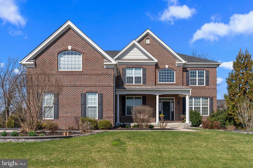 SHOWINGS BEGIN FRIDAY. Step into luxury with this meticulously crafted 7 years young Duke Lexington model by Toll Brothers boasting over $200K in upgrades in the highly desirable neighborhood of Warrington Glen. Located in Bucks County and within the prestigious Central Bucks School District, this fantastic open concept home offers 4 bedrooms, 3 full and 1 half baths across 4,455 square feet of magnificence.

Set on a beautifully landscaped picturesque .35 acre lot with stunning curb appeal and upgraded hardscaping, enter the covered front porch and step inside and gaze at the gorgeous two-story foyer with crystal chandelier and curved staircase with custom runner, wainscoting, and beautiful hardwood floors throughout the whole first floor. To your right is the formal living room adorned with trendy wainscoting and crown molding. Through the 15 pane glass French doors is a generously sized private office/study, ideal for those who work from home.

The two-story family room is impressive, featuring a cozy gas fireplace with floor-to-ceiling stone hearth and loads of natural light from the many windows. In addition to recessed lighting is a lovely statement chandelier. This room flows seamlessly into the gourmet kitchen making this the ultimate entertaining space. The enormous kitchen is truly a chef's delight, boasting upgraded cabinetry including corner glass cabinets equipped with accent lighting, granite countertops, stone backsplash, stainless-steel appliances, gas cooking, pantry, and a massive center island with breakfast bar and pendant lighting. There is plenty of space for the largest of tables in this upgraded in size eat in kitchen area with glass sliding doors overlooking the private and fully fenced rear yard with expansive paver patio and pergola. Continuing on is a separate formal dining room featuring crystal chandelier, wainscoting and crown molding, spacious enough to seat large gatherings for the holidays. Finishing off the main level is a powder room and mud/laundry room with laundry tub sink. 

Head upstairs and find yourself on a grand landing of hardwood flooring with posts and curved balcony overlooking the main living area. Down the long and wide hall that is flanked with crown molding for added elegance, enter through the double doors and find yourself in the owner's suite of your dreams. This is a pure oasis with tray ceiling and fan, sitting room, dressing area with 3 walk in closets, and a built in vanity. The double door spa-like ensuite has dual sink areas with granite counters, soaking tub with large arched window for natural light, frameless glass stall shower and a water closet. Bedroom 2 is a princess suite with tub shower combo, and two additional spacious bedrooms are down the hall that share another full bath.

The full basement offers loads of space for future finishing, or use for a home gym or for all of your storage needs. This exquisite home also features high ceilings throughout all levels, irrigation system, security system with nest cameras, 2 zones of heating and cooling, whole house water filtration system, passive radon system, and three car garage with epoxy coated floor and 50 AMP outlet for an EV charger. Conveniently located near tons of shopping and dining, Routes 202 and 309, and the PA Turnpike, this home offers the perfect combination of luxury, comfort, and convenience. Don't miss your opportunity to own this exceptional property! 1-YEAR HOME WARRANTY INCLUDED for added peace of mind!