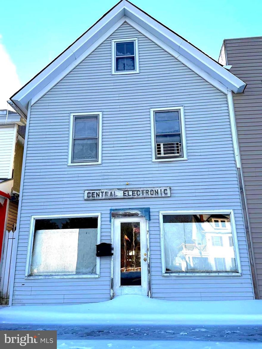 Investors Alert!  Great potential here for a wide variety of uses.  Business downstairs and rent the upstairs residential area earning additional income.   Being sold strictly "as is" but the potential for an office or small business on the first level and the residential part with two bedrooms on the second level makes this a perfect fit for the business owner to either live upstairs or rent the upstairs while the lower level is used for a business.  A good carryout business,  crafts and florist business, fresh farmers produce stand,  ice cream parlor and/or sweets shoppe could all be fantastic in this location -- great size and centrally located in the beautiful town of Ridgely -- known for its strawberry festival, car shows, parades, and other community events.  Call today to schedule your showing.  Needs work but the potentials are there.  Bring your vision and bring it to life here!!!