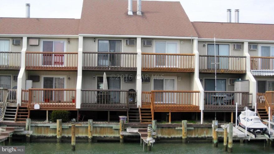 This waterfront 3 bedroom town home offers easy access to the bay, it's close to beach & shopping. Newly installed roof w/50 yr warranty. Walk right out your back door to your privately deeded boat dock. The boat dock right off the deck is so convenient. There is a fireplace on the 1st floor in the living area. Dining area & kitchen are directly adjacent. Half bath located off of kitchen area. On this floor also, is washer & dryer. This floor has ceramic tile flooring throughout for the cool beachy feel. The second floor has a waterfront master bedroom, the 2nd bedroom & full bathroom. The 3rd floor is a private bedroom area great for large families or friends. This is a great spacious property with water front views and bay access, all while your boat is docked at your back door.