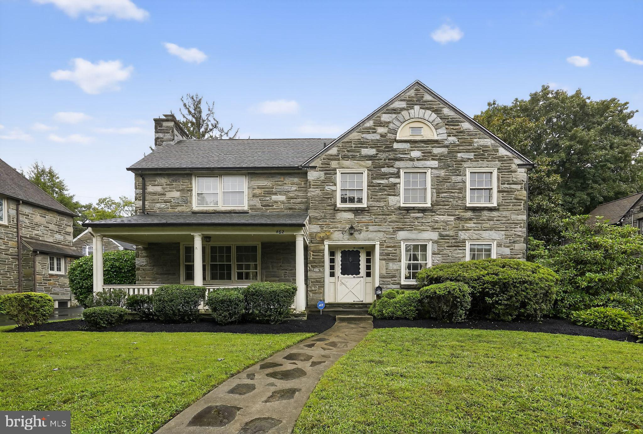 This classic, stone faced, Drexel Hill Colonial is just waiting for its next owner. Step right up onto the big, covered front porch and imagine relaxing there after a long day’s work. Enter in to the center hall foyer with beautiful hardwood floors that run through much of the home. The living room is off to the left and comes complete with a fireplace. The dining room is off to the right and has charming built-ins for added convenience. Just beyond the dining room is the light and bright eat in kitchen featuring gas cooking and 2 pantries. Let’s head over to the cozy den with fireplace that would be the perfect spot to unwind after a long day. A powder room and laundry room round out the 1st floor. Just up the stairs to the 2nd floor you will find the spacious primary bedroom with a walk-in closet and ensuite bathroom with shower stall. There are 3 more nicely sized bedrooms and a remodeled hall bathroom with shower/tub combo. As a bonus feature, this home also has an attic which provides plenty of extra storage space. A partially finished basement finishes off the indoor space of this home. Outside there is a 2-car detached garage, and a hot tub located in the rear yard. With its convenient location, added charm, and timeless features, 462 Derwyn is the perfect place to call home. Schedule a showing today and enjoy the Fall in your new space.
Please note: Central Air is on the 2nd Floor only.