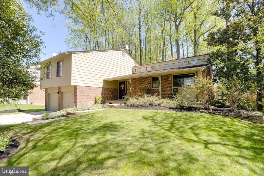 This beautifully remodeled split-level home in sought-after Burke offers the perfect blend of space, style, and privacy. With four finished levels, five bedrooms, and 2.5 baths—including a finished lower-level fifth bedroom ideal for a guest suite, teen retreat, or private home office—the layout is designed for flexibility and modern living.

The contemporary kitchen features granite countertops, stainless steel appliances, an induction cooktop, and a cozy dining nook for everyday meals. Hardwood floors and tile span the upper levels, while multiple living areas—including two spacious living rooms and a dedicated lower-level media and recreation space—provide plenty of room to relax, work, and entertain.

Upstairs, the primary suite features a beautifully renovated bathroom with modern finishes and a sleek glass-enclosed shower. Additional bathrooms have also been tastefully updated, offering a clean, contemporary feel throughout the home.

The finished lower level is a standout feature, offering incredible versatility with space for a home office, fitness area, media room, or additional living space—perfect for today’s work-from-home and active lifestyles.

Set on over one-third of an acre, the private, wooded backyard provides a peaceful, park-like setting. Enjoy a large deck off the main living area and a separate patio off the lower-level family room—creating seamless indoor-outdoor living. Tucked away on a quiet cul-de-sac, this home offers a true sense of retreat.

Inside, enjoy the warmth of a wood-burning fireplace with a brick hearth in the lower-level living area, along with a modern bio-ethanol fireplace that serves as a striking focal point in the main living space.

Additional highlights include generous storage, thoughtful updates throughout, and well-maintained systems.

Ideally located near Burke Lake Park trails, Occoquan Regional Park, and the Workhouse Arts Center. Convenient to shopping and dining, including Wegmans, Whole Foods, Trader Joe’s, and the Burke Farmers Market. Commuters will appreciate easy access to Fort Belvoir, major routes (I-95/395/495 and Fairfax County Parkway), Springfield–Franconia Metro, VRE, and direct bus routes.

This home offers space, flexibility, and a move-in ready lifestyle in a peaceful Burke setting