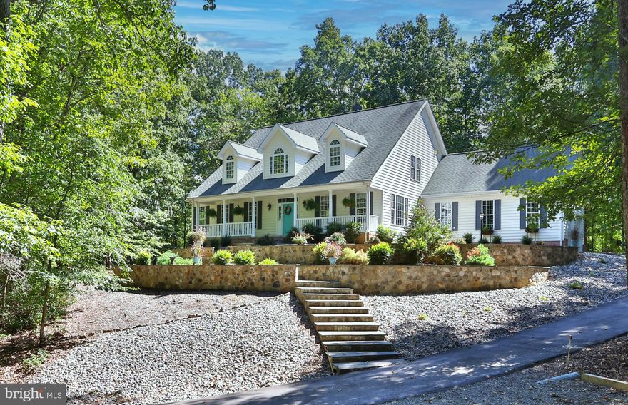 Off a quiet cul-de-sac, and invisible from the street, this Estates of Chancellorsville main-level living home is simply gorgeous, with over $80,000 in upgrades since 2020. The long, recently paved driveway welcomes you home, winding through almost 5 acres of mature hardwoods and wildlife habitat.  

The first impression is striking, with stone terraces and easy-care shrubs creating a welcoming, well-manicured entry. Step inside to discover the show-stopping family room with a 29’ vaulted ceiling, a wall of new triple-pane, energy-efficient windows, and a warm, natural gas fireplace. The spacious, primary suite opens onto a full-length, covered, rear porch and is complemented by a second main-level bedroom that is well-suited for a home office or guest room. 

The chef’s kitchen is both beautiful and functional, featuring granite countertops, twin wall ovens, a prep sink on the center island, and classic raised-panel hickory cabinets. Under-cabinet lighting adds a subtle touch of refinement. Upstairs, two en-suite bedrooms (each with a private bath) are connected by a cozy sitting area — perfect for watching TV, gaming, or just reading. 

Downstairs, a full-length, fully framed, 1,700 sq. ft, walkout basement offers endless possibilities — whether you're envisioning a rec room, workshop, home theater, or other future living space. 

The recent upgrades include all new carpet and paint, newly updated bathrooms, and tasteful finishes. Additional highlights include: a 50-year architectural roof, 16KW natural gas standby generator, and walk-in above-garage storage. This house is literally a true hidden gem — custom-built and beautifully maintained. If you're seeking privacy, character, and main-level living