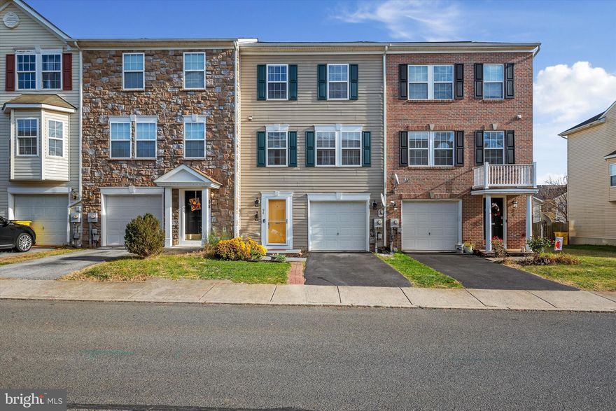 Spacious townhome with beautifully renovated kitchen, fresh paint, and updated flooring throughout! This 1-car garage unit features a 3-level bump out for extra living space, a private fenced backyard, and all 3 levels above grade. The main floor has two living spaces flanking the remodeled kitchen with its exquisite granite counters, newer appliances, and ceramic tile backsplash. Upstairs are 3 bedrooms -- all with vaulted ceilings -- plus a light-filled primary bedroom with a large en-suite bath featuring a Jacuzzi tub, shower enclosure with glass doors, and double vanity. The entry level has a partially finished rec room with entrance to the fenced yard, laundry facilities, and already-framed rough-in for another full bath. Enjoy easy access to commuter routes, local amenities, and area attractions like historic Harpers Ferry, Charles Town Casino & Races, and more. This home is move-in ready, and the location right off Rt. 9 can't be beat!