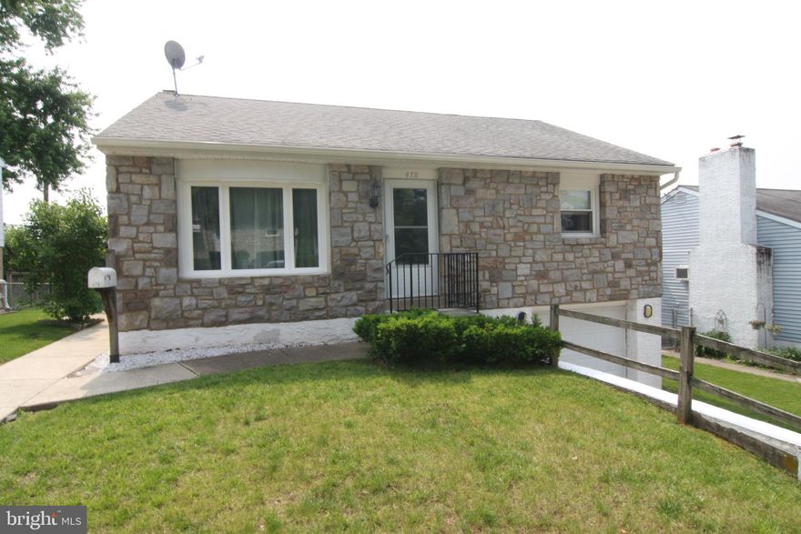 Welcome to 478 Spring Street. One of the more      walk-able tree lined neighborhoods  around. This       stone front rancher has much to offer. This  Home  has a Large Living Room, Eat in Kitchen, 2 Large Bedrooms and Full Bath. All on the main floor.     But wait, there is more! Basement offers another  240 Sq. Ft of living space along with a Laundry      Area and entrance into the over sized  Attached Garage that has storage space even after the car   is parked. Basement also has a walkout into the    fenced in yard. This well maintained home is           perfect for a buyer just starting out or even someone looking for a smaller, quieter home to slow    down in. Come take a look at  this home and              neighborhood and be ready to unpack your bags...