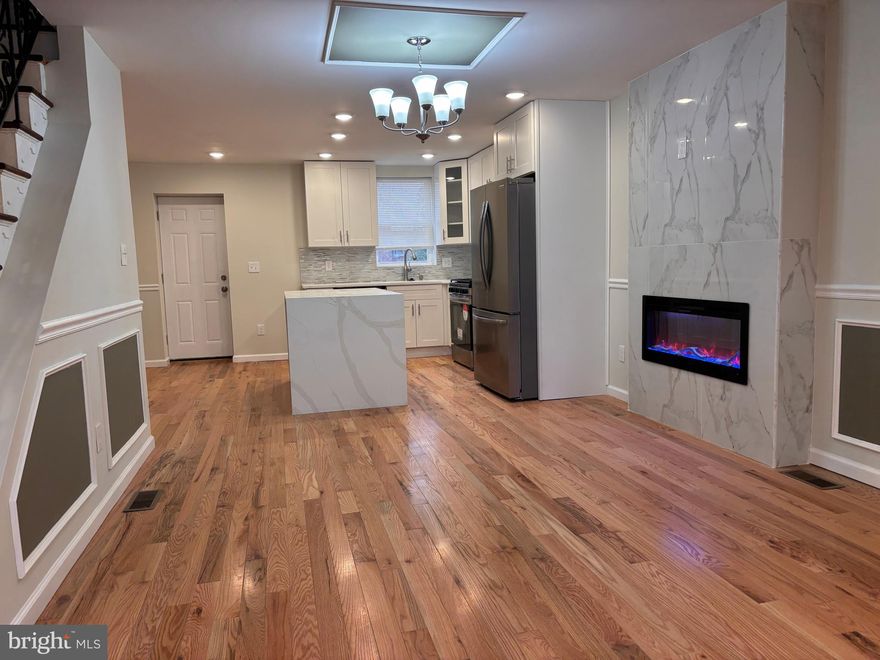 Move right in! This FOR SALE house is conveniently located in a quite Ogontz. This gorgeous 4 bedrooms 2.5 bathrooms home is fully remodeled with elegance and comfort in mind. Open concept layout living and dining area with new hard wood flooring thru out the house, chair and base molding and recessed lighting. Living room also features one of a kind fireplace that is a statement piece. Beautiful chandelier completes a spacious dining room. The kitchen features brand new cabinets with state-of-the-art self-closing doors, quartz countertop, sleek backsplash, and all stainless-steel appliances. Very large deck of the kitchen big enough for the entire family. The upstairs offers a master bedroom with on suite bathroom and closet, there are two additional bedrooms with plenty of closet space. Second floor also features a European spa like bathroom with imported vanity and elegant tile. No detail was overlooked. The finished basement boasts plenty of open space for entertaining and new carpet. Downstairs also features another spacious bedroom and half bath That's not all, this home features brand new HVAC, electric, plumbing, roof with warrantee, all permits have been pulled and all inspections have been passed. Owner is a licensed real estate agent.