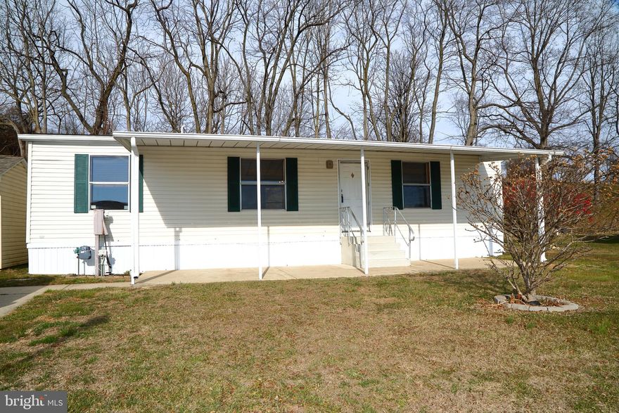 This beautiful home offers fresh paint, new carpet, a newer HVAC system,  water heater, plus a modern updated kitchen. Situated on an elevated lot with a gorgeous view you'll love coming home to it.  Why pay rent when you can own your own place. Lot rent includes Cable and trash.