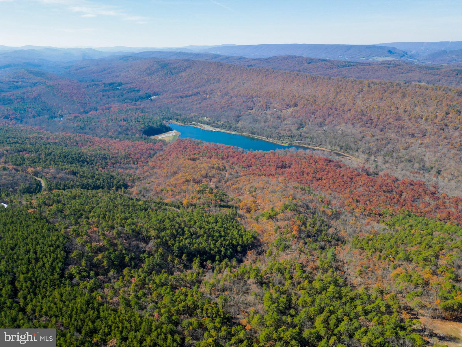This beautiful 20.94-acre tract in Yellow Spring, WV, is the ideal blend of adventure and tranquility. The land lays gently with a natural slope to the center, where, with a little clearing, you'll be rewarded with mountain views in the distance. Half pine and half hardwood, it’s perfect for homesteaders dreaming of building their own cabin with materials sourced right from the land!
RV owners, weekend warriors, and campers will find this spot ideal, too—park your RV, set up camp, and enjoy peaceful weekends away from it all. Hunters and nature lovers will love this place as a base camp for exploring Wild, Wonderful West Virginia. Plus, HOA-maintained gravel roads mean easy access without the hassle. Electric poles already run along Doe Garden Drive, and it’s perc approved for 4 bedrooms, so you’re all set to start planning and building!
Only 15 minutes to Wardensville for small-town charm, 40 minutes to Moorefield, 45 minutes to Winchester, VA, and less than two hours from Washington, DC—this property offers a world away within reach of everything you need. All it’s missing is your vision!