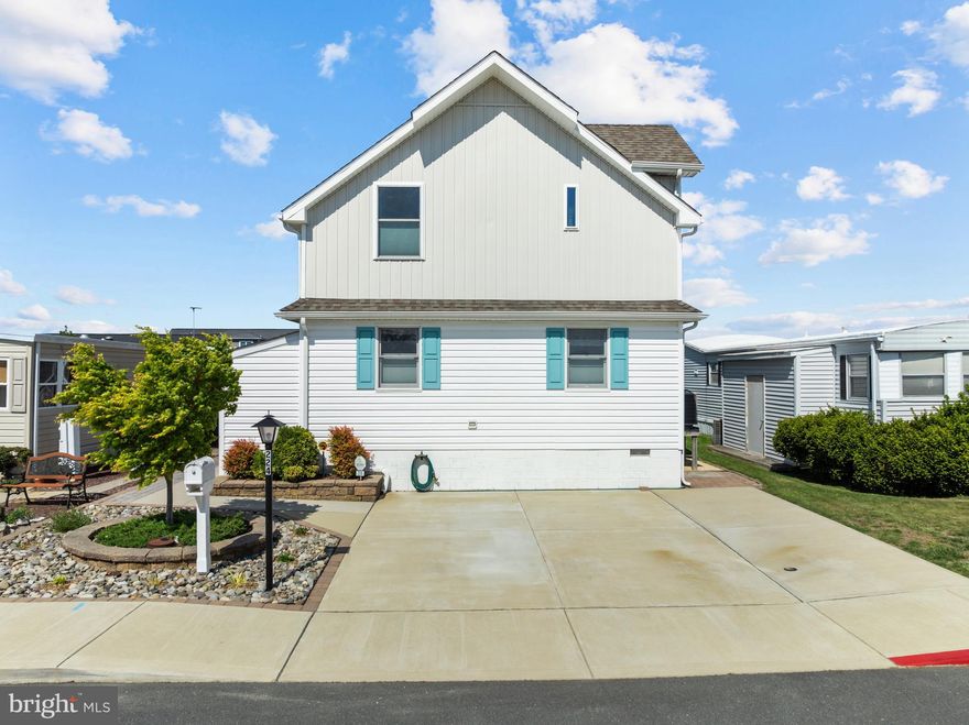 Nestled in the charming Montego Bay community in North OC, this delightful coastal-style home offers a perfect blend of comfort and convenience. Originally built in 2001, with the new second floor and first floor renovations being done in 2019, this detached residence boasts 2,088 square feet of potential, ready for your personal touch. Interior features include 4 bedrooms (2 Master Suites), 4 bathrooms, a den, stainless steel appliances, custom 42" cabinets, granite counters, ceramic back splash, luxury vinyl plank flooring, gas fireplace, tankless hot water heater, and so much more. The low-maintenance lot, spanning 0.08 acres, provides just the right amount of outdoor space for relaxing next to the water. Outdoor features include a boat lift, dock, pier, a covered 1st level deck, and an open 2nd floor deck...all done in maintenance free decking. You'll appreciate the nearby amenities which include 2 inground swimming pools, a kiddie pool, 2 tennis courts, pickle ball courts, a shuffleboard court, a 9 hole mini-golf course, a wildlife sanctuary/park area with pond and blacktop walking/jogging path,and a bayfront boardwalk with 3 fishing/crabbing piers...all for a low hoa fee of $415.00/year!! This property is not just a house; it's a canvas for your future memories. Embrace the opportunity to make this charming residence your own. Call now to schedule your private showing!
