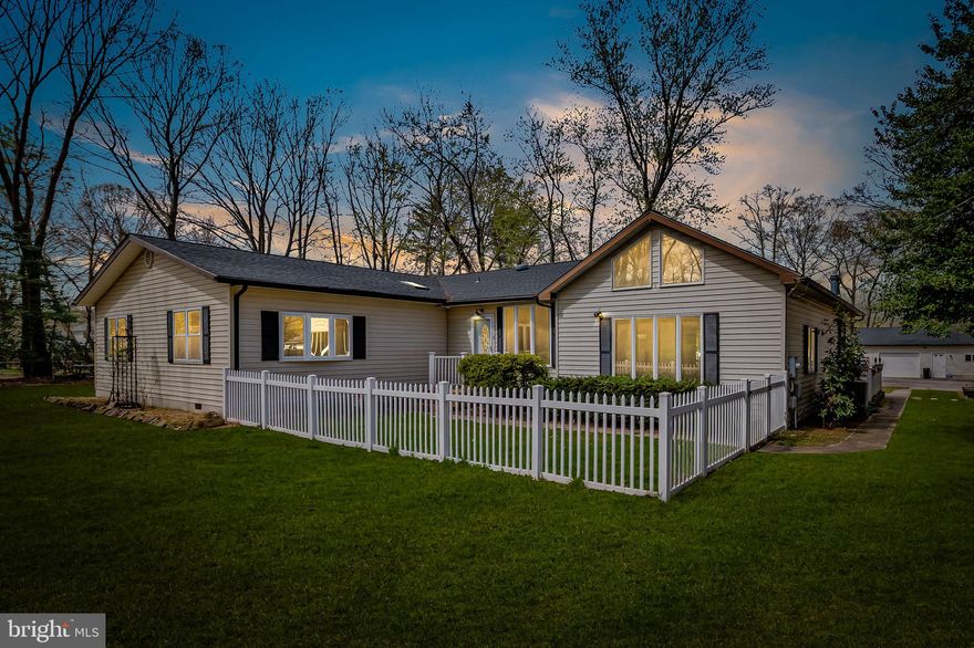 PLEASE DO NOT ENTER DRIVEWAY WITHOUT CONFIRMED APPOINTMENT. Welcome to 168 Burns Crossing Road, a rare find tucked away on a private, flat one-acre lot in the heart of Severn. This beautifully updated home offers a peaceful setting with plenty of space to relax, entertain, and enjoy the outdoors. Whether you're looking for a quiet escape, a place to host friends and family, or room to explore hobbies, this property has it all. Outside, you'll love the incredible features that make this home stand out. There's a huge garage with its own bar, workshop space, and plenty of room for parking, plus a greenhouse, pond feature, and even a chicken coop! A screened-in porch and spacious deck make outdoor entertaining easy and enjoyable all year round. And the ample parking outside of the garage allows for up to 10 cars, and maybe more if you're creative! Recent updates and maintenance give you peace of mind and modern comfort. The djainfield line was replaced in 2025 with the septic system pumped in 2024, and the well pump serviced in 2023. The heating system was converted from to oil to buried propane, and the AC units were replaced in 2021 and 2024. The water heater was replaced in 2023, and the roofs on both the home and garage were replaced in 2021. Inside, the home features stylish upgrades, including luxury vinyl plank flooring throughout (installed in 2020), new kitchen and laundry appliances (2022), butcher block countertops, and a living room bar for eating and entertaining. The layout has been reimagined to include a primary walk-in closet, home office, and a fenced front area perfect for pets or play. This location offers the perfect mix of country feel and convenience. Fort Meade is just a short drive away, and major commuter routes like MD-32, -175, and I-97 are all within minutes. The Odenton MARC Train Station is only about 15 minutes away, making commuting to D.C. or Baltimore a breeze. BWI Airport is also just 20 minutes from your door, perfect for travelers. Nearby amenities include Giant Food, Food Lion, and Aldi, all within a 10-15 minute drive. For shopping and dining, head to Arundel Mills Mall—just 15 minutes away—featuring popular restaurants, entertainment, and retail stores. If you love the outdoors, you’ll find Severn Park, Joe Cannon Stadium, and Kinder Farm Park all within a 5-mile radius, offering trails, sports fields, and peaceful nature walks. With its private setting, thoughtful updates, and unbeatable location, 168 Burns Crossing Road is truly one-of-a-kind. Come see it for yourself—this gem won’t last long!