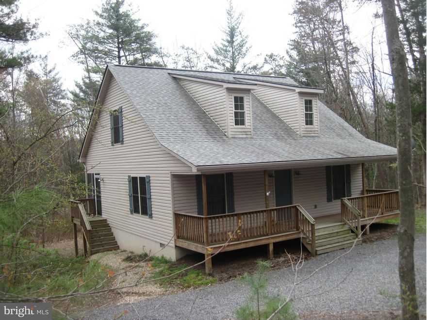 PETS ON A CASE BY CASE BASIS.  ABSOLUTELY NO SMOKING!!  Built in 2007; it feels like it's brand new when you walk in! Bamboo floors, Cathedral ceilings with skylights bringing in the sunshine, and a screened porch add to its charm. One bedroom/bath on each level plus a loft area that is perfect for reading, games, and it has a sleeping nook. Most furniture conveys PLUS there is a 2nd lot!