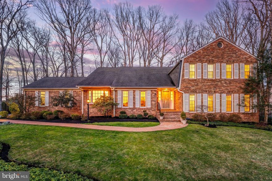 There’s something about this home that just feels different the moment you walk in—the light, the openness, the way each space naturally connects without trying too hard. The main level is designed for real living, with Italian porcelain tile and hardwoods, a sunken family room anchored by a brick fireplace and wet bar that becomes the heart of the home, while vaulted ceilings in the living and dining rooms create volume and presence without losing warmth. The kitchen is generous in size with granite, double ovens, cooktop, and a beverage cooler already in place, but more importantly, it offers the kind of footprint buyers are always hoping for—one that can be reimagined into something truly special. A main level bedroom and full bath add flexibility for guests, office space, or multigenerational living, and the oversized laundry and mudroom off the side-load garage bring everyday function that actually makes life easier. Upstairs, the primary suite lives more like a private retreat with its own sunken sitting room, a fully custom bath wrapped in marble from floor to ceiling, a soaking tub, body spray shower, dual vanities, and built-ins that give you storage without compromise. The additional bedrooms are all well-sized, finished with new hardwoods, and supported by a thoughtfully updated bath. Every major system has already been handled—newer HVAC, 40-year roof, generator, irrigation, updated electrical panels—so the focus stays on how the home lives, not what needs to be done. And then there’s the backyard, which is where this property truly sets itself apart. Fully fenced and backing to trees, it feels private and layered, with a custom stone patio, expansive deck, and hardscaped paths that guide you through what is genuinely an award-winning garden. This isn’t just landscaping—it’s a curated outdoor experience with fruit trees, rhododendrons, camellias, peonies, and seasonal blooms that change throughout the year, giving the home a rhythm and beauty you can’t replicate. The lot itself is substantial both front and back, with mature plantings and intentional design that feels established and peaceful. All of this sits in a location that makes daily life easier and more connected—just minutes to the W&OD Trail, Meadowlark Botanical Gardens, Wolf Trap, Tysons, and major commuter routes—while still feeling tucked away. Zoned for the Madison pyramid and with no HOA, this is the kind of home that gives you space, flexibility, and a setting that actually enhances how you live.