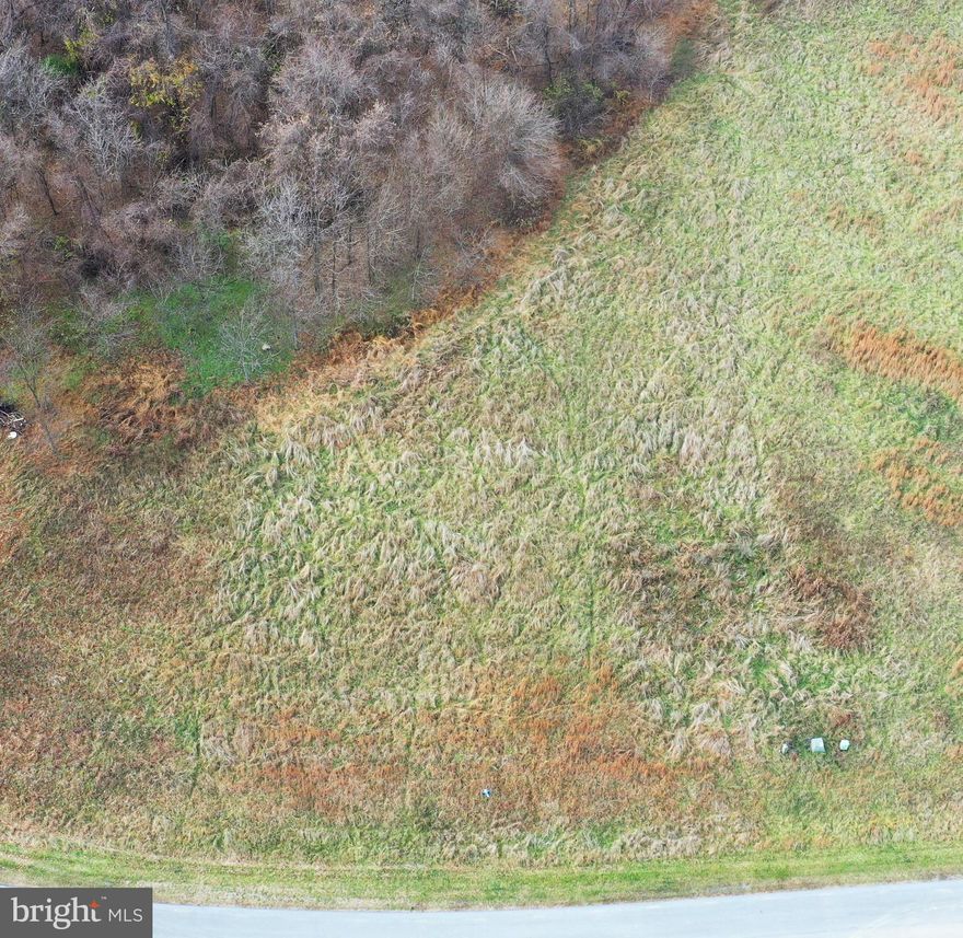 BUILD YOUR DREAM HOME IN THE COUNTRY! Ideal commuter location in a rural area just north of Martinsburg. Convenient to Interstate 81 and a short drive to a 137-acre county park .  Lovely 1.7-acre partially wooded building lot on Elegant Drive. In Brookside, a subdivision of spacious, higher-priced homes in the $500,000s to $700,000s.  Underground utilities.  House sizes (excluding basements,  garages, decks and porches, overhangs) are required to be at least 2,200 square feet for single-level house and 2,400 square feet for a multi-level house with at least 1200 square feet on the first floor. Enjoy nearby Poor House Farm Park, a beautiful park that is open dusk-to-dawn year-round and features a stocked fishing pond,  walking trails, pavilions, playground area, volleyball court,  disc golf course, an equestrian arena, and a barn for events.