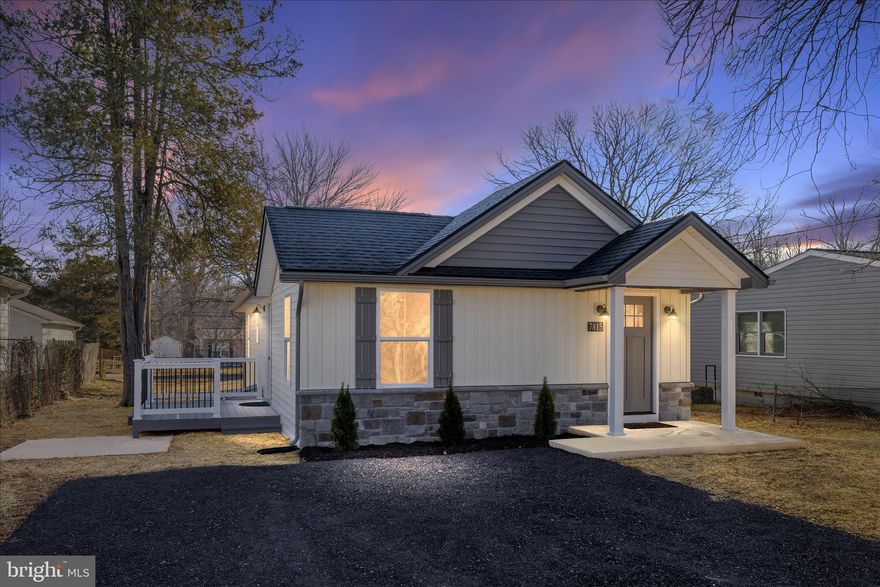 This beautiful home is tucked away on a quiet dead-end street and offers modern finishes, functional living space, and timeless charm. Step inside to an open, light filled layout featuring luxury flooring, custom wainscoting. The kitchen showcases beautiful cabinetry, stainless appliances and sleek countertops. Perfect for everyday living and entertaining, the inviting living area is anchored by an electric fireplace creating a warm focal point. Outside you can enjoy a charming porch and generous yard with room to relax, garden or entertain! 2 car driveway along with offsite parking behind this beauty!