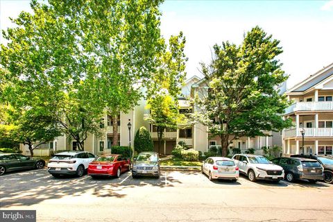 Photo of 14305 Climbing Rose Way #101, CENTREVILLE, VA 20121 (MLS # VAFX2313164)