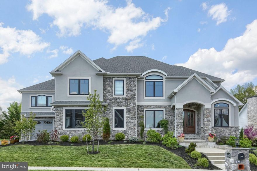 Welcome to Deaven Woods, a charming cul-de-sac neighborhood with 35 custom built homes in Lower Paxton Township. This 4,840 sqft home is situated on a 1/2 acre lot in Central Dauphin School District. It is finished with stone and stucco on three sides. The home has a 4 Car Garage, a 38 foot rear patio with both covered and uncovered areas, an exterior wood burning masonry fireplace, and a built in gas grill with granite tops. Ultra high efficiency heating and cooling systems with variable speed blower with dual zones as well as tank-less water heating make the home comfortable in all seasons. The first floor boasts an oversized wood kitchen island, with granite tops on the perimeter cabinetry. The kitchen has an eat in table with walk in pantry that offers additional counter space The spacious Family Room has an 11'-0" coffered ceiling with custom crown molding. The Living room could be purposed as a Dining Room to complete your entertaining needs on the first floor. There is an additional Home Office/Study, powder room, and mudroom to complete the first floor. The 2nd floor Primary Suite offers separate His/Her closets, an oversized walk in shower and separate His/Her vanities with marble counters. The upstairs Laundry room offers generous counter space as well as built in folding tables and custom drying racks. The Jack and Jill suite features a walk in shower
with bench seat, and the 4th bedroom features an en-suite with a large tub. All bedrooms offer walk in closets with custom wood shelving. The finished daylight/walkout lower level is complete with a wet bar, recreational area, a home gym, and a full bath.