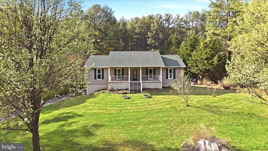 Experience peaceful country living with modern convenience in this charming traditional 3-bedroom and 3-bath ranch home on 5 private wooded acres.  The main level features hardwood flooring throughout, a spacious living room with a cozy gas fireplace, a formal dining room, and a bright eat-in kitchen. The fully finished walk-out basement expands your living space with a large family room,  gas stove, full bath, and generous storage, making it perfect for guests, recreation, home office, or multi-generational living.
The covered front and rear porches overlook wooded views, perfect for relaxing, entertaining, or enjoying nature. The property also includes a detached oversized 2-car garage, poultry house, and ample space for gardening, homesteading, hobby farming, or outdoor recreation.
This home includes a whole-house generator, providing peace of mind and year-round reliability.
Ideally located for both privacy and convenience, this home is just minutes to I-66 for easy commuting and close to Skyline Drive, Shenandoah National Park, local wineries and vineyards, hiking trails, farmers markets, and charming small towns. Enjoy nearby outdoor adventures, scenic mountain views, and the best of Northern Virginia countryside living. This rare combination of acreage, privacy, modern upgrades, and prime location makes this country retreat a must-see.