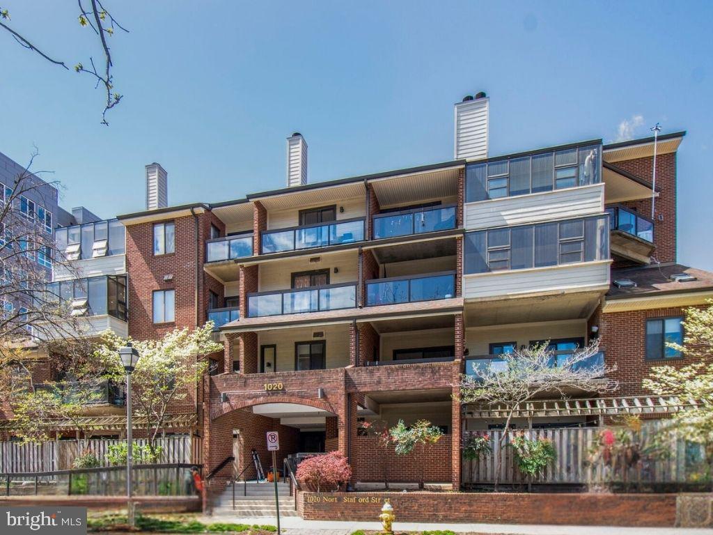 This sunlit condo at Summerwalk Condos (1020 N. Stafford St) offers a prime location near Ballston’s business district on a quiet, tree-lined street. Features include high ceilings, oversized windows, a large private balcony (110+ SF), and an open living/dining area. The kitchen provides ample storage and a pass-through to the dining area. The spacious bedroom includes a home office/sitting area and a wall of closets. A fully renovated bathroom boasts a walk-in shower and modern finishes. Additional perks: in-unit laundry, garage parking, private storage, secure entry, a courtyard with grills, and proximity to Ballston Metro, I-66, shops, restaurants, and parks. The garage is under renovation and will be available at the end of December.