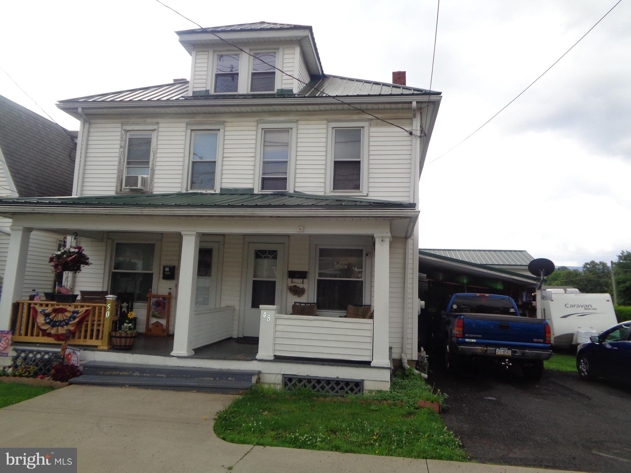 Borough duplex offers 3 bedrooms, 1 bath on one side and 4 bedrooms, 2 baths, carport & off street parking on otherside. Adjoining 70' x 119' vacant lot included in sale, subject backs up to Rec Park & borough walk path.