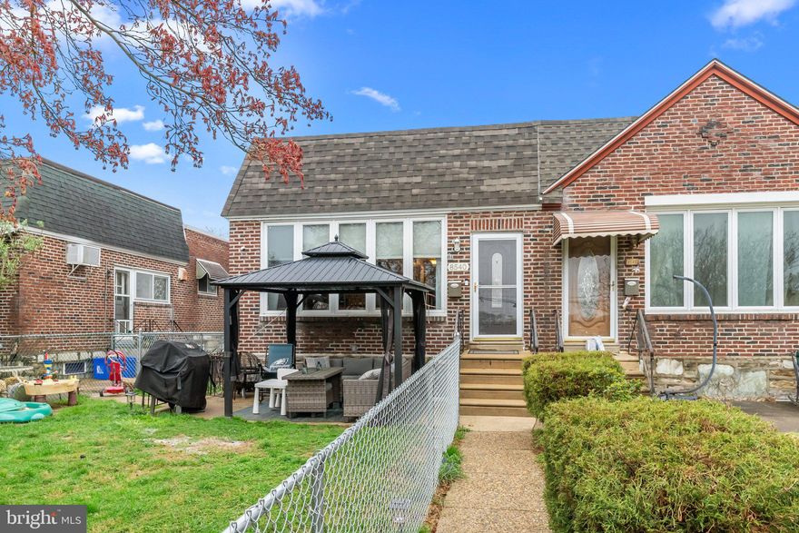 Welcome to 8540 Frontenac Street, a beautifully maintained 3-bedroom, 2-bathroom brick home nestled in the highly sought-after Bells Corner neighborhood of Northeast Philadelphia. This charming semi-detached residence blends timeless appeal with modern updates and offers everything you need for comfortable city living.

Step inside to a spacious and light-filled living and dining area featuring sleek wood-style flooring, neutral tones, and an open layout that effortlessly flows into the updated kitchen. The kitchen features warm wood cabinetry, corian countertops, stainless steel appliances, a gas range, and plenty of counter space—perfect for any home chef.

All three bedrooms are generously sized with ample natural light, and the full bathroom on the main level has been recently renovated featuring new tile flooring, a pedestal sink, and a newly glazed tub with crisp white tile. The fully finished lower level offers an incredible bonus space—ideal for a playroom, home gym, second living area, or guest quarters. It includes a second full bathroom with a custom tiled shower and modern finishes, a separate laundry/mud room with new utility sink and additional storage space. The lower level is completed with a waterproofing french drain for peace of mind during inclement weather and a whole house PEX plumbing system.

Outside, enjoy the fenced-in front and side yard with a dedicated patio area—perfect for entertaining or relaxing.  A one-car attached garage and private rear driveway provide convenient off-street parking in addition to extra storage space.

Located on a quiet street in Bells Corner, you’re just minutes from local parks, schools, shopping, and major roadways for an easy commute to the city, suburbs, or even New Jersey. Don’t miss your opportunity to own this move-in ready gem in one of Northeast Philly’s most desirable neighborhoods! Showings will begin at the Open House on Saturday April 26th from 1-3PM.