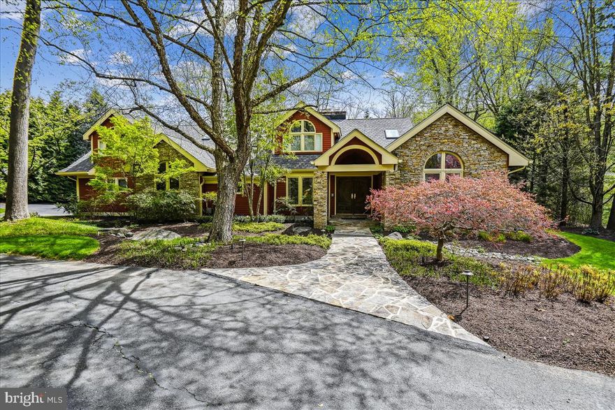 Situated on a private cul-de-sac,  this contemporary  home offers 6 bedrooms, 5.5 baths. The first floor boasts an open floor plan with generous living spaces and enchanting views.  The living room features a dramatic cathedral ceiling with a stone wood burning fireplace.  The spacious gourmet kitchen has granite counters, a Viking 4-gas burner w/griddle and range, Subzero fridge, second oven,  Bosch dishwasher, wet bar, room for large kitchen table and a large island with seating.  Enjoy the seamless natural flow from the kitchen to the light filled family room with wood burning fireplace, cathedral ceiling and custom built-ins.  French doors in the family room, dining room and living room welcome you outside to the gorgeous patios and gardens.  First floor primary bedroom is a true retreat with vaulted ceiling, seating area, gas fireplace and luxurious spa bathroom.  The first floor includes a dedicated home office, half bath and a convenient  laundry/mud room next to the 3-car oversized garage.  The second level is accessed by the front and back staircases.  There are 4 additional bedrooms and 3 full  baths,  including a spacious in-law suite and a bonus study area. The lower level includes the 6th bedroom, full bath, family room with a fireplace and exercise area. Beautifully curated landscaping with patios and a pond provide the perfect backdrop for relaxing. Entertain with ease indoor and outdoor. This premier Ruxton location is convenient to I-83 and 695, minutes to downtown, Lake Roland Park and Greenspring Station. Updates: Architectural Shingle Roof 2022,  3 new gas furnaces, 2 water heaters (2016) ,Flagstone Front Walkway, Exterior Painted 2021, Interior Painted 2016. You will always look forward to going home!