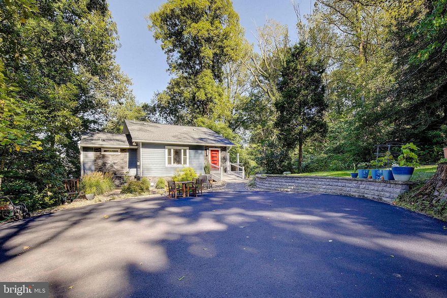 Professional Photos are coming soon.  This is a one of a kind amazing home which has been loved by this owner and made even better with the following: 2017-gas fireplace, foam insulation in attic and crawlspace 2018- New energy efficient siding(lifetime warranty), new sump pump  2019- Professional Landscaping to include drainage 2021- New Split Units total of 8 modules and 2 systems(24k)very efficient  2022-added whole house generator, 500 gal propane tank owned and installed for fireplace and generator 2023- New roof, soffits, gutters and all exterior doors deck level(lifetime warranty). The current owner has made modifications which are energy efficient and higher quality than your standard improvements. Now lets talk about the house....This home has a lovely wrapped around deck which makes you feel like you are in a treehouse. Can have all year water views with trimming of some trees currently there is fall, winter and spring views to the Patuxent. Sit on your deck and enjoy your very own private oasis. The nicely paved driveway with extra parking leads you to the beautifully professional landscaping. Once inside this home you will fall in love with the unique style, tall ceilings, and multi-levels. You enter on the kitchen level which is perfect for coming home with groceries not too far or many steps to get them inside the home.  The kitchen is open and bright with the added touch of the warm fireplace perfect for romantic dinners! Step up to the upper level offering its own powder room this space offers vaulted ceilings, and view of the water. Add a Juiliet balcony if you desire. This space could be converted into another bedroom if you wanted or use it as an office/family room or more! From the main level step down to the primary living room/great room which is super cozy and offers 2 french doors out to the expansive deck. The primary bedroom is just off this room offering vaulted ceilings 2 good sized closets and it one of a kind full bathroom. On the next level offers you 2 rooms one being a bedroom and the other a nice office or guest room you choose. On the lower level you have another living space which could be a gym, cave of some sort, play room or more. This level also offers the full laundry room and storage. The owner also encapsulated the crawl space on this level and it is dry and conditioned which offers great storage. Nice location, no HOA.