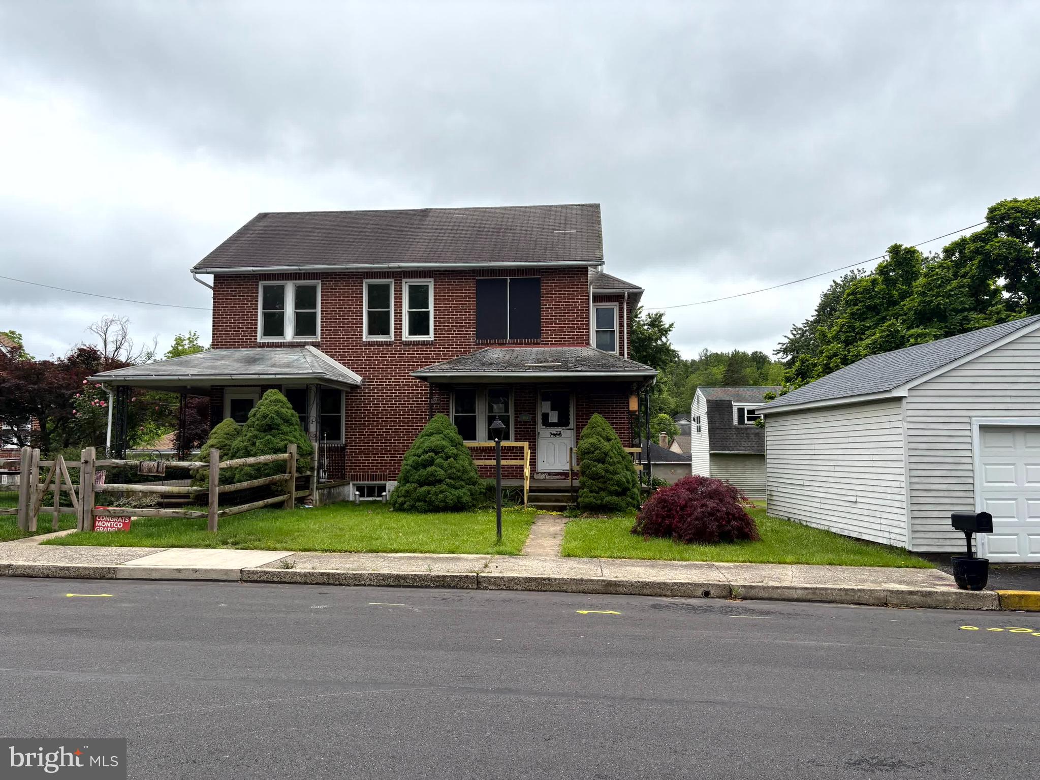 Still Available for YOU! Fantastic Opportunity to own a brick Twin in Green Lane. Perfect location close to all parks, recreation, amenities, and major routes. Steps away from the Post Office and Main and Gravel Pike. The enclosed rear patio tucked behind the house offers a separate sanctuary to get away or entertain. The lot extends across the rear driveway to the Creek.