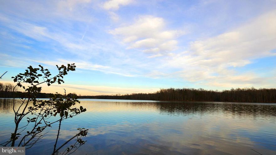 Beautiful 2.76 acre waterfront lot. Property is located on Hunting Run Reservoir. Conveniently accessible from main road (Plank Road) and situated within established neighborhood (Bishops Manor) with paved roads. Zoned RU. Short drive to Spotsylvania Mall, Walmart, Costco etc. shopping area and easy access to I-95. Soil analysis and drain field feasibility have been done.  Under Documents.