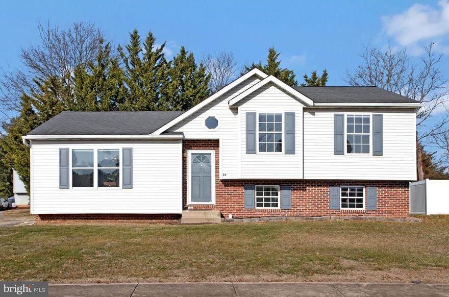 SSoaring ceilings welcome you the moment you step inside this lovely four-level, three-bedroom, three full bath home, set in a quiet, country-like setting that feels peaceful without feeling remote. Natural light pours into the entry through a skylight above the cathedral ceiling, instantly giving the space an open, airy vibe.

Throughout the main level, luxury vinyl flooring and fresh, neutral paint create a clean, modern look that’s easy to love. Subtle details like chair rail molding add just the right amount of character. The eat-in kitchen is bright and inviting, featuring warm maple-toned cabinetry, granite countertops, stainless steel appliances, and under-cabinet lighting. A skylight, sliding glass door to the walk-down deck, and a charming box-style garden window fill the space with sunshine, making it a wonderful place to cook and gather.

Upstairs, you’ll find three comfortable bedrooms with fresh carpet, fresh paint, and window treatments already in place. The primary bedroom overlooks the peaceful rear yard and includes a private full bath with an upgraded cherry-tone vanity and updated countertops.

The lower level offers a spacious family room with its own full bath, making it an ideal spot for movie nights, guests, or a home office setup. Sliding doors open directly to the level, sun-filled backyard, where evergreen trees provide a natural, calming backdrop.

Outside, the flat yard offers room to relax or play, with a convenient storage shed for tools, lawn equipment, or outdoor gear, and there’s plenty of off-street parking with just a single step into the home — practical and convenient. Altogether, this home offers space, light, and a comfortable flow, wrapped in a setting that feels calm, welcoming, and easy to settle into.