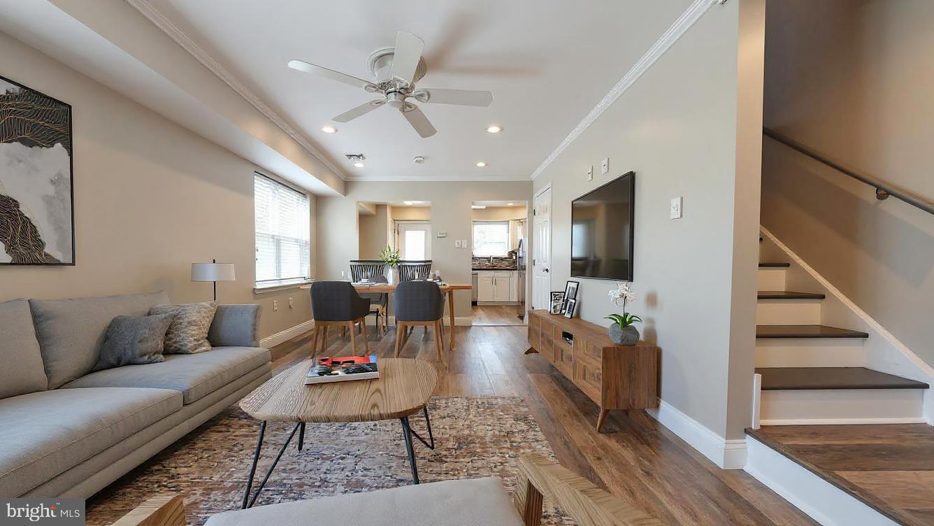 Welcome to this beautifully renovated three-story, 3 bedroom/2 bath home located in the vibrant Francisville neighborhood of the Art Museum area! Thoughtfully updated and move-in ready, this home offers modern style, great space, and the rare opportunity for 3 car parking! A charming front yard with landscaping leads to a bright and sunny living room featuring new hardwood floors, decorative moldings, recessed lighting, and a large picture window that fills the space with natural light. The renovated kitchen is a true highlight, featuring impressive white cabinetry, stainless steel appliances including a 5-burner gas range, a sleek glass tile backsplash, breakfast bar, and a pass-through window that opens to the dining and living areas—perfect for entertaining! Open the kitchen door to access the rear patio and your private parking area. The second floor offers two spacious bedrooms and an updated full bathroom. Upstairs, the third floor is home to the luxurious master suite complete with a renovated full bathroom. The finished basement, with egress, provides a fantastic bonus space with high ceilings, recessed lighting & wood floors- ideal for a home office, media room, or guest space. Additional features include: customizable Elfa closet systems in all bedrooms and a tankless hot water heater. Perfectly located to many cafes, restaurants, public transportation and easy access to Center City, this home combines modern comfort with city convenience—and the unique benefit of multiple parking spots!