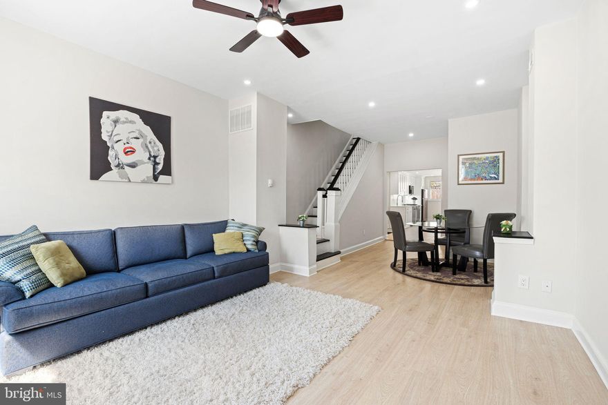 This beautifully renovated Manayunk home blends modern finishes with a thoughtful, functional layout across three spacious levels. Every inch has been upgraded — including new kitchens, bathrooms, flooring, drywall, recessed lighting, and reconfigured floor plans designed for contemporary living.

The first floor features a bright, open-concept living and dining area anchored by a sleek kitchen with stainless steel appliances, quartz countertops, and custom cabinetry. A convenient half bath and access to a private rear patio make this level perfect for everyday living and entertaining.

The second floor offers two comfortable bedrooms and a large full bathroom with a double vanity and glass-enclosed shower.

The entire third floor is dedicated to the primary suite — featuring a generous bedroom, dual closets with California Closet systems, a linen nook, a spacious en-suite bath, and direct access to a private roof deck with sweeping views of the Manayunk Bridge and Schuylkill River.

Additional highlights include:
– Built-in California Closet systems in every bedroom
– Freshly sealed basement with laundry and utilities
– Updated mechanicals and central air

Move-in ready and ideally located, this home offers turnkey convenience with elevated design — just minutes from Main Street, transit, and local trails.