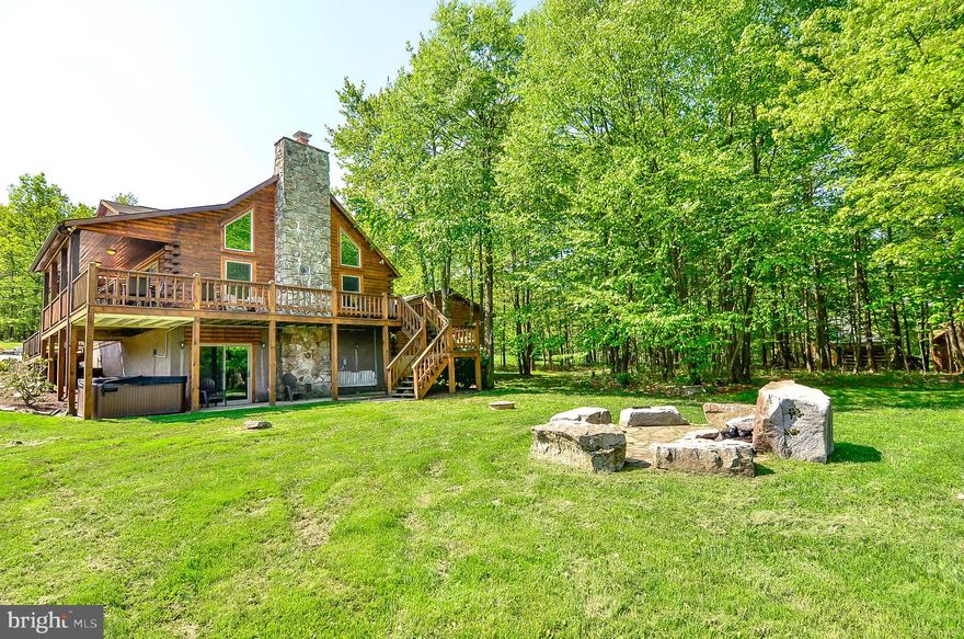 Recently Updated Lake Access Log Home at Deep Creek’s “Pinnacle” - Boasting epic Mountain/Lake views, this 5Bed 3Bath log lodge features loads of outdoor decking, massive stacked stone fireplace, and your very own dock slip at Deep Creek Lake! Open concept living with modern kitchen complete with stainless appliances, granite tops and hardwood cabinets. Three levels of finished living space with a second living-room in the lower level walk-out basement. A well-established vacation rental - “Morning Glory” grossed over $77k in rental income in 2022. Centrally located to State Parks, Local Restaurants and Wisp Resort, but tucked away from seasonal traffic in a private mountain top community. “The Pinnacle” offers tennis courts and nearby community lake access, for swimming, fishing, kayaking and boat docks. Detached two car garage and stone firepit completes the beautiful 1 acre outdoor space. Don’t miss your chance to see this incredible mountain getaway… Call today for details!