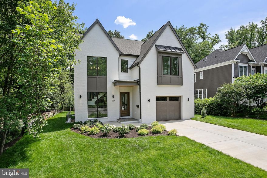 Welcome to 409 Timber Lane, the newest addition to The Little City from local builders, Ten Penny Homes. Sitting on a flat quarter acre lot in the City of Falls Church just minutes away from the brand new Founders Row development and downtown Falls Church, this 5,000+ square foot, 6 Bed/6 Bath modern Colonial Farmhouse concept welcomes you in with oversized front windows letting light pour into the foyer and front hall. The formal dining room sits right off the main entrance, while the main living space opens up to the sleek chef's kitchen and back porch. The gorgeous Chef's Kitchen lets you entertain in front of the main living room with top of the line JennAir Noir Series appliances, a built in panel refrigerator, a custom 9 foot quartz island and custom cabinetry. A walk-in pantry sits right off the kitchen leading into a mud room connecting to the oversized garage. An office/flex bedroom with en suite bath sits off the back of the main floor allowing for main level living if needed. On the 2nd floor you'll find the Main Bedroom with 2 separate walk-in closets and master bath with heated floors and 6 foot soaking tub along with 3 auxiliary bedrooms with en suite baths in each. The fully finished basement opens up with a large open rec room area and wet bar for entertaining, a full guest suite, and a separate bonus room for a gym, media center, or custom finish of your choosing. The home is fully pre-wired for sound and security cameras through Sight and Sound Systems with 4 separate zones (basement rec room w/subwoofer, kitchen/living room area, outdoor deck, and master bedroom suite) with wireless Bluetooth capability.