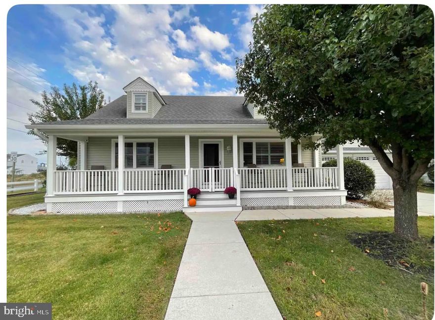 Large Cape Cod on 2 lots in West OC - Walk to Harborside and many other restaurants! Larger and better in Person!  So much potential and Beautifully maintained 4 Bed 3.5 Bath Cape Cod in West OC- NO HOA FEE! This home sits on a double lot  with 2 separate driveways with gated entrances, in DESIRABLE area of West Ocean City!  Walk to Harborside, Sunset Grille, The Shark, Water Taxi to OC,  Crab Alley and more.  Located less than a five minute walk to Public Boat Ramp. Great for boaters and Fishermen! 
Landscaping is Established and Professional.  Large Magnolia tree, Weeping Willow, Crape Mertles- feels like an English Garden!  Potential for Invisible Fence, Alarm system,  Inside Wireless speakers throughout.   2 car Garage,  Split Rail Fencing, private keyed side Gates for animals,  driveways can fit up to 5 cars including boats and RV, has RV hookup.  Private entertaining area with Custom Boat Style Blinds to keep out the wind and cold and enjoy watching tv next to your cozy propane firepit.  Jacuzzi Hot Tub included! Newly added office / bonus room above garage, updated Garage Bathroom, Fresh paint, New Landscaping lights, Electrical panel, Hot Tub, Mostly furnished with TVs in many rooms including fabulous outdoor entertaining area!  New Gas S5 burner stove top.  Beautiful Side Sun Room used for extra guest or office! Private Guest Quarters on 2nd level with 2 HUGE BEDROOMS AND LARGE FULL BATH.  MAIN LEVEL PRIMARY BEDROOM  with Gorgeous Tile in Large double shower and 2 private water closets.    2 Full closets both walk in, one with safe and closet organizer.  Plantation shutters throughout!   Huge Front porch to enjoy your summer days, cool starry nights and people watching! Come see this OUTSTANDING PIECE OF PROPERTY!   Great Investment, location and quality built!