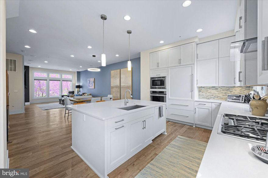 What an extraordinary value for an exceptional offering!  Barlow Place, built by EYA,  offers not just a beautiful and exquisitely appointed living space across 4 levels with elevator access, it offers one of the best locations in Bethesda with access to everything from everyday conveniences like daily shopping and the Metro at your footsteps, to fine Dining, culture, and quick Beltway access – this is not just a stunning home, it’s an incredible lifestyle.

ENTRY LEVEL FEATURES 
Step right in to a gracious receiving foyer with custom wallpaper, gorgeous Bedroom #4/Office with custom built-in wall cabinet, storage and shelves, mobile-extendable desk with pop-up USB connection, wine fridge, custom barn door on casters, and additional drywall added to expand the space.  The en-suite full Bath makes this a fabulously flexible space, and cleverly conceived, custom-built under-stair storage is designed to perfectly tuck away coats, hats/gloves/scarves, and shoes.  Access to a 2-car rear load garage and a large storage closet. 

MAIN LEVEL FEATURES
Dramatic wallpaper follows you up the stairs into an expansive, open floor plan with high ceilings, LVP flooring, and incredible natural light through floor-to-ceiling windows.  The top-of-the-line Kitchen features white quartz countertops with seating for 3-4 at the large island, white cabinetry to the ceiling, gorgeous, glass tile backsplash to the ceiling, stainless steel appliances, and a walkout to the balcony perfect for grilling. A holiday-dinner-sized Dining area with a stunning light fixture, a large Great Room anchored by a gas fireplace, a charmingly tucked-away bar area that makes this space an entertainer’s dream, and a discreetly tucked-away Powder Room.


UPPER LEVEL ONE FEATURES
Luxuriously appointed Primary Suite with 2 walk-in closets with custom cabinetry, remote controlled window shade, an ensuite Bath with dual vanities, Carrera look tile floor and shower, and a glass shower surround; Bedroom #2 with Murphy desk to maximize space, and generous, custom designed closet; Bedroom #3 with custom designed closest, Full Bath #3 with custom wallpaper, Laundry Room with custom storage cabinets and linen closet.

UPPER LEVEL TWO FEATURES
Like living at a 5-star hotel with rooftop entertainment space!  Dining area, living room with gas fireplace (covered by an automatic retractable awning), an outdoor lounge area, TV hookup, gas grill hookup, an artfully concealed wet bar and beverage fridge, non-slip custom flooring, and unencumbered tree top views, some of the most desirable spots within the community.

OTHER FEATURES
Whole house wired for security including window alarms; HVAC, Fireplace and Elevator services 1-2x per year/bi-annually); your dog’s dream location just steps to Fleming Park, .6 miles to Metro Red Line at Grosvenor; .1 mile to Metro Bus; 1 mile to Wildwood Shopping Center (Balducci’s, Starbucks, CVS, Flower Child, LPQ, Rakugaki, Prima Piatti, Dry Cleaners, boutiques), 2.5 miles to Strathmore Hall.  Walter Johnson HS, North Bethesda MS, and Ashburton ES.