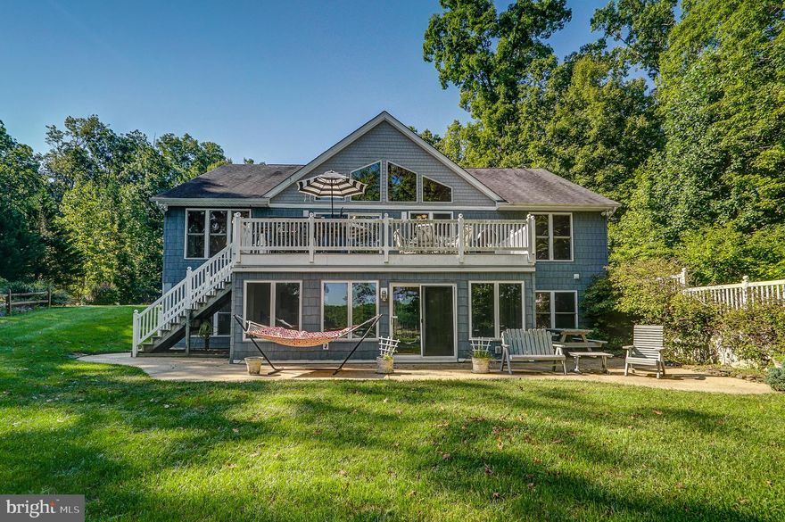 Welcome to the lake house! Beautiful waterfront retreat located in a no wake zone, in sought after Freshwater Estates on the public side of the lake with 125 ft of shoreline. Featuring 4 bedrooms, 3.5 baths. Relax and unwind in over 3,800+ Sqft and start making your memories here. At this retreat you'll enjoy an open floor plan and so many upgrades to include two main level primary suites complete with their own baths, hardwood flooring, granite counters, vaulted & wood ceiling and a stone gas fireplace. The family room and dining area is open to the kitchen that has a breakfast bar and granite counters. A living room, sitting area, reading nook room that overlooks the lake, half bath and laundry room complete the main level. The walkout basement has a family room, recreation room with a large wet bar, two bedrooms, a full bath, storage room, and an additional room that could be used for extra sleeping. Whether you are relaxing by the Franklin propane stove in the four-season sunroom, on the concrete patio lounging in the hammock, BBQing on the large deck, sitting on the covered front porch or down at the boathouse by the fire pit, you will love entertaining your family and friends here. Nestled on a 1.7 acre lot with  gorgeous lake views and plenty of privacy, you are sure to get a true lake experience here. Two car attached garage, paved driveway, 16KW Generac generator, and a separate storage shed. Covered boathouse with vinyl marine decking, an electric lift, screened in room, storage area and a sun deck! Great lake location on the popular Contrary Creek where you'll also enjoy its incredibly convenient location, roughly 45 minutes from Richmond, 90 minutes from DC, less than 5 miles from the town of Mineral, about 6 miles from the New Bridge Landing Shopping Center, where you'll find groceries, restaurants, ABC, nail salon and the nearby vet clinic, nursery, Lake Anna Taphouse and other local wineries and breweries. HVAC and tankless water heater 2016, composite decking 2019, dishwasher 2019, oven and refrigerator 2014. Septic inspected and pumped 2020 and a radon mitigation system was installed in 2020. Some furniture conveys! Neighborhood does allow short term rentals. Schedule your tour today!