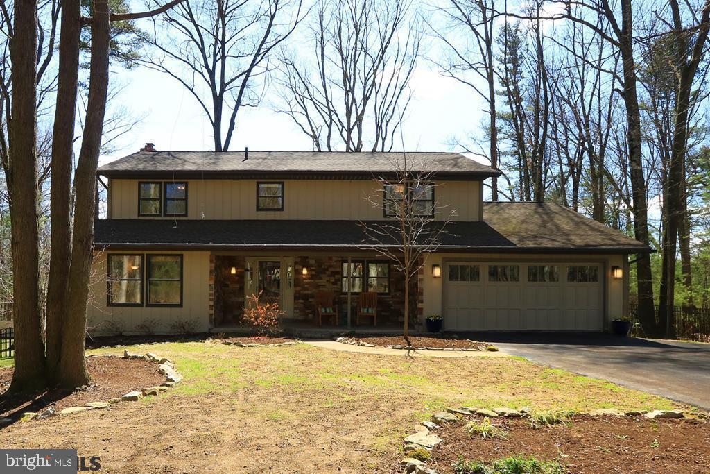 Extraordinary blend of classic rustic and with modern flair in The Valley! Attention to detail with quality in mind embodies this peaceful, private 1 acre retreat minutes from downtown State College and Penn State. Fully renovated, you'll enjoy the warmth of bamboo, wood, and cork floors, plentiful windows with abundant light, open spaces, and an abundance of beautiful views. Outdoor living abounds ? soak up nature on the front porch, expansive deck, 3 season sunroom, or lower patio. From high end lighting and quality, solid-wood cabinetry, to custom tile work in the baths and master closet built-ins, this home has it all. A finished walk-out basement with wet bar and 2nd half bath provides additional entertaining and rec space. Hobby space is covered with several storage rooms and a workshop/utility space. Experience ample sun in the expansive, fenced back yard while enjoying extensive landscaping and the privacy of surrounding woods. A stone's throw to State Lands to boot!