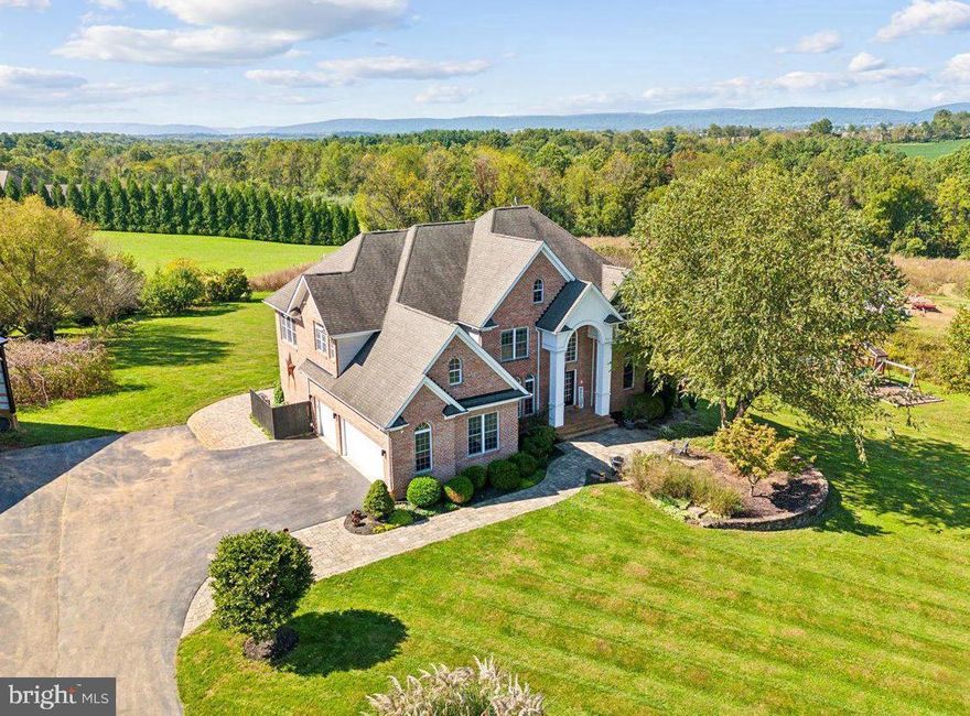 Welcome home! Enjoy the rare opportunity for multigenerational living in desirable Middletown School districts. Sitting on over 11 acres, be prepared to fall in love when you're greeted with a two story foyer, open concept kitchen, and two story great room with scenic views. Enjoy accessibility with main level living with ADA-compliant bedroom and bathroom. Upstairs you'll find the impressive primary bedroom with tray ceilings and an additional flex space! Your primary bathroom is fully equipped with a large soaking tub, shower, heated towel rack and water closet. Your additional 3 bedrooms upstairs include two connecting rooms via Jack and Jill bathroom, and an additional bedroom with its very own ensuite. This stunning home also features a large open basement with opportunity around every corner. With a full bedroom, bathroom, wet bar and walk out access, the possibilities are endless! Outdoors, you'll find a relaxing deck off your updated kitchen, an oversized garage with ample additional parking driveway, and an impressive two story pole barn right. Escape to your backyard oasis featuring mountain views, chicken coop, butterfly & vegetable garden, and private creek access. Previous owners had several acres maintained by a local farmer; future buyers to verify agricultural tax benefits. UPDATES: New tankless water heater (2023) quartz countertops (2023) New HVAC system (2022) New well system (2022) UV light & Water softener (2020). See additional updates in disclosures Don’t miss your chance to own this slice of paradise—schedule a showing today!