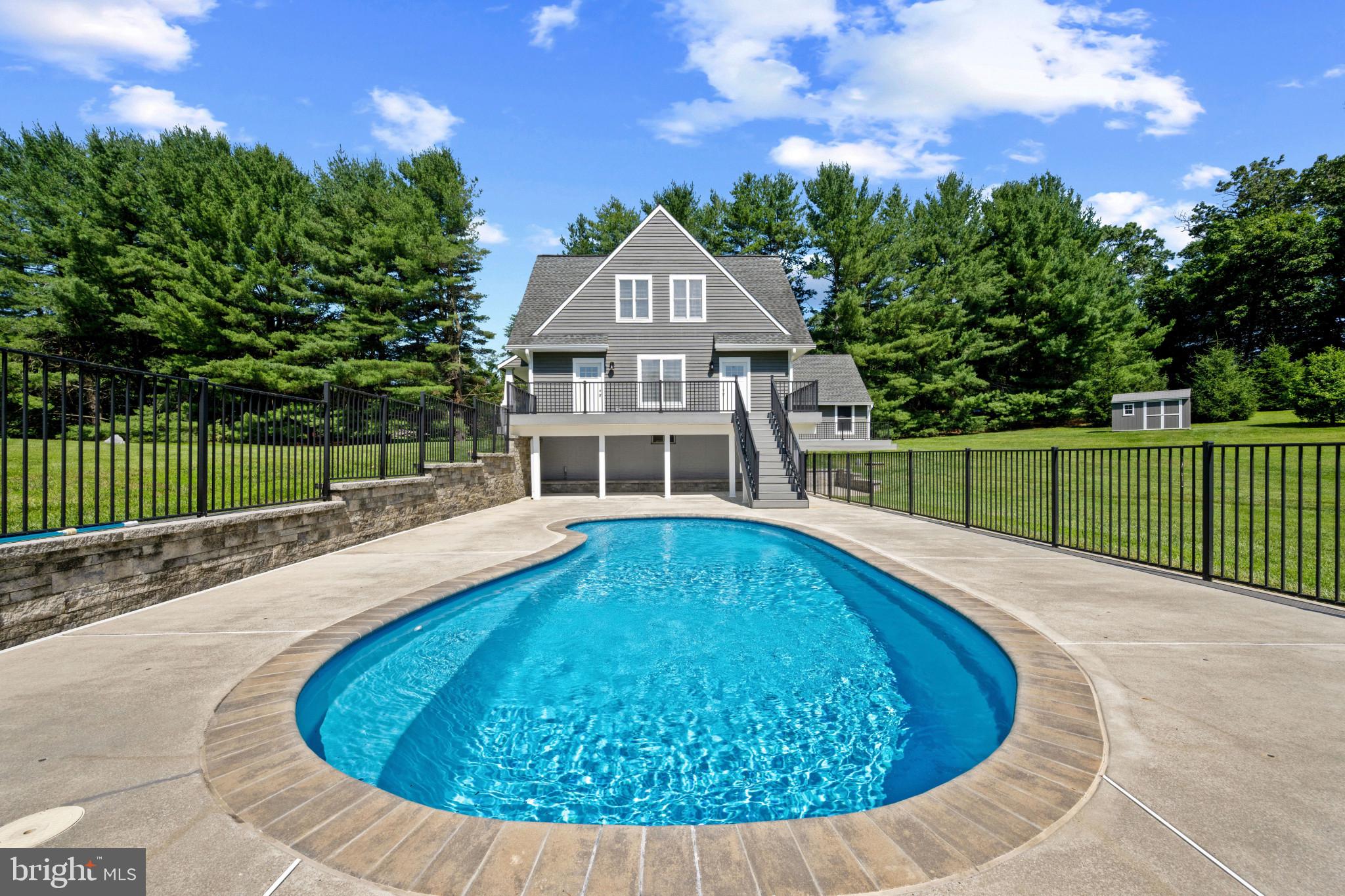Major price improvement! A private paradise mere minutes from I-795! Mature trees line the perimeter of this 2+ acre property, which features plenty of open space with the house at the center. The home includes four bedrooms with a first-floor primary bedroom option that includes a walk-in closet featuring a custom closet system adjacent to a dedicated laundry space. Extensive updates abound, with upgraded kitchen and baths, luxury vinyl flooring throughout, and a full unfinished climate-controlled walk-out basement with bathroom rough in. The eat-in kitchen flows into a dining and living area with fireplace, connecting to a Trex deck balcony overlooking the expansive view with access stairs to the pool area.
The front porch, back deck and side deck overlook the gated fiberglass heated inground saltwater pool, which features plenty of space for chairs and umbrellas as well as ample shaded area with covered seating space. Watch an array of wildlife from a quiet cul-de-sac street location set back from the road to enhance your privacy.
No neighborhood association, covenants, or HOAs. Easy walk or drive to the school bus stop at the
neighborhood entrance if needed. Detached garage for quiet coming and going, with separate
sheds for lawn and pool equipment. The property includes its own well with a
purification system as well as brand-new septic field. The house stays powered during
outages with a separate generator-driven emergency panel. Enjoy the indoors during the winter season with a new furnace and enjoy the ambiance of a fireplace insert that accommodates either firewood or pellets. This idyllic turn-key home could be your place to enjoy all that life in Maryland has to offer.
Check out the interactive 3D map and virtual tour!
Agent is related to seller.