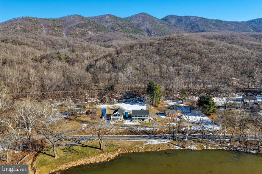 This is a unique and rare opportunity to own two houses with over 300 feet of river frontage in Page County. This property consists of 2homes: the first is 1,344 SF on unfinished basement with 3 bedrooms and 2 baths, while the second is 896 SF on unfinished basementwith 2 bedrooms and 2 baths. Both homes feature cathedral ceilings, maintenance free exterior siding and decking, granite countertops, LVP flooring, hottubs, and much more. The river frontage includes lifetime picnic tables and grills. Both homes are currently being used for a short term rental businessand are fully furnished with everything an investor would need to operate

They are both active short term rentals with direct river access making both of these properties lucrative.
Relax with the whole family at this peaceful place to stay. Amazing river front property, fishing in the river (must have fishing license), picnic table and charcoal grill along river, fire pit behind house, close to Shenandoah National Park, Massanutten Resort, Luray Caverns, New Market Battlefield and much more. There is one security camera that monitors the front door. Off street parking