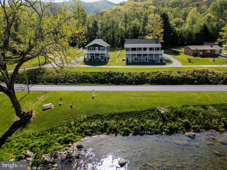 37 & 39 Whistle Lane, 2 profitable vacation rentals in one! These properties must be sold together.  They are both active short term rentals with direct river access making both of these properties lucrative.
The larger house has 3 beds & 2 baths with an unfinished basement. Smaller house is 2 beds, 2 baths, also with a basement.  Relax with the whole family at this peaceful place to stay. Amazing river front property, fishing in the river (must have fishing license), picnic table and charcoal grill along river, fire pit behind house, close to Shenandoah National Park, Massanutten Resort, Luray Cavern, New Market Battlefield and much more. There is one security camera that monitors the front door.
The space
Amazing views of the river and wild life, upstairs large spacious living room with eat in kitchen and bar, 3 bedrooms with queen beds, 2 full bathrooms, washer/dryer, hot tub on back porch. Off street parking