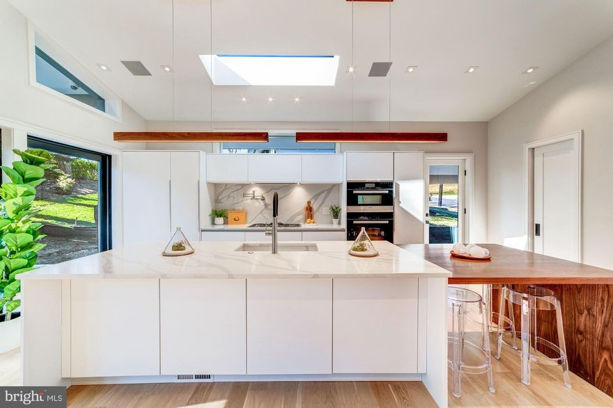 OPEN HOUSE SUNDAY (7/14) 1-3PM. This house is in truly mint BRAND NEW move-in condition! Have you met with a contractor/builder recently? Have they shared their recent experience of increased construction costs and delayed DCRA permitting??? You can bypass the renovation headache with this property! NEW PRICE! A fabulous Forest Hills renovation by Coba has brought this late 1950s home a new life in the 21st century!Two luxurious levels include 5 Bedrooms,4.5 Bathrooms, and approx 4,100 SF of thoughtfully re-designed living space with only the highest quality finishes and detail. Open floor plan includes a grand living space with 12.5-ft cathedral ceiling and walls of windows including sliding glass doors opening to a private rear garden allowing for seamless indoor-outdoor entertaining. Must see in person to appreciate unparalleled quality!