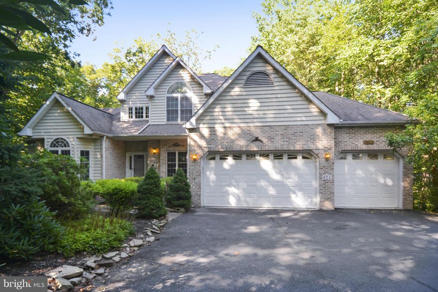 Large traditional, custom built home beautifully situated on secluded, wooded lot at end of cul-de-sac. 1st floor master suite. great room w/cathedral ceiling & FP,  large kitchen/breakfast room & formal LR/DR.  4 BR's & Den (or BR 5) on upper level, Wood floors throughout. L/L rec. room, BA & French doors to patio. Deck & huge screen porch off kit. Lush landscaping, Generator & 3 CAR garage.