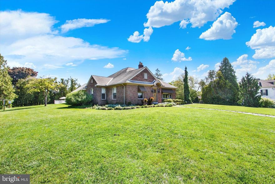 Expansive 2,816 sq ft brick rancher on 1.45 peaceful acre lot sits conveniently near shopping, restaurants, YMCA and more.  Front door leads into the notably large living room with vaulted ceilings with exposed beams, wood flooring and stone wood-burning fireplace.  Continue into formal dining room and eat-in kitchen with double island.  Kitchen has a side entry leading to the flagstone patio.  Celebrate the Nation's 250th Birthday with family and friends in the family room that leads to your own private salt-water pool!   No need to worry about parking for this event with 4 garages and more spaces in the driveway!  3 nice size bedrooms all with wood floors and 3 full bathrooms and additional recreation room on the upper level.  Don't miss the opportunity to make this home yours!  Schedule your showing now.
