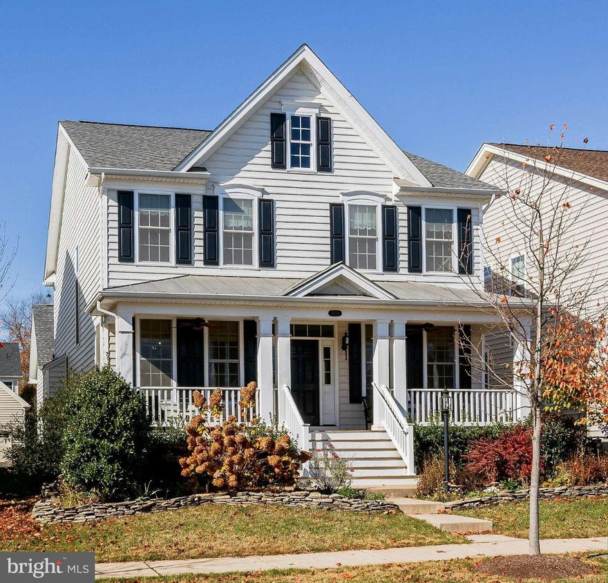 DOMINION VALLEY 4BR 3.5BATH FrontPorch, ML Wood Floors. Formal LR+DR w/CustomMoldings,Kitchen w/ Granite+SSAppl+CastIronSink+IslandBreakfastBar/Pantry. FamRm w/GasFP+Mantle  LaundryRm, RearGarage w/FloorEpoxy. MBR w/TrayCeiling, En-Suite: SoakingTub+CeramicShower+GraniteVanity w/DoubleSinks. 3 Add'lBR's share CeramicBath. LL RecRoom+FullBath NewCarpet+Paint  StateoftheArt MultimediaWiring thru out